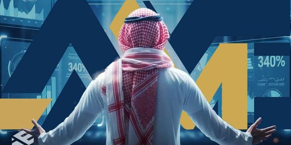 Man in traditional Middle Eastern attire analyzing financial data on digital screens.