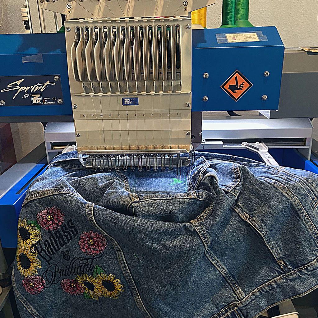 Badass and Brilliant Denim Jacket on embroidery machine.