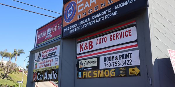 Signage of the vehicle service and repair shop's name off El Camino Real in Encinitas, California. 