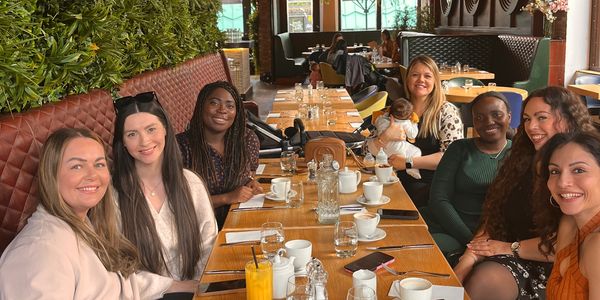 Group of mums, women,sat down at a cafe