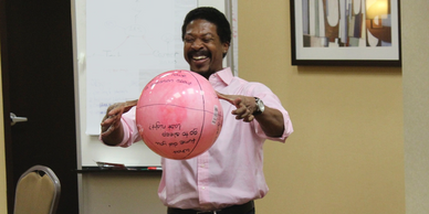 Man catching a ball during a reflection exercise at a training workshop