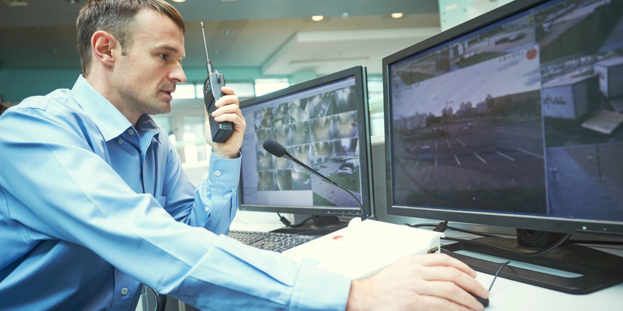 Security agent reporting what he sees on the CCTV cameras