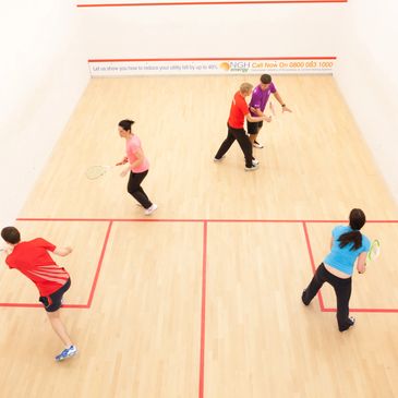 5 players roaming the squash court