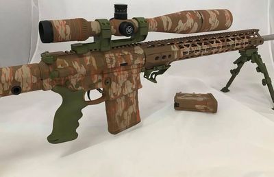 Camoflauge rifle done with Cerakote Firearm finish by Guardian Custom Firearm Coating in Navarre Florida.