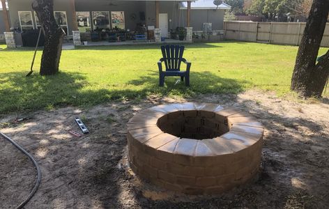 A compressed earth block fire pit