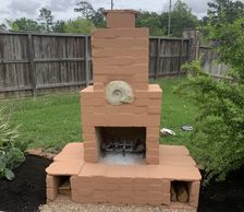 A compressed earth block outdoor fireplace