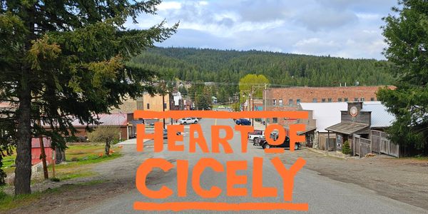 Small town street with 'Heart of Cicely' text overlay.
