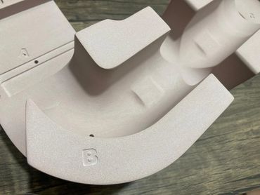 Machined part in composite resin