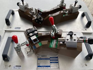 Hose assembly check fixtures