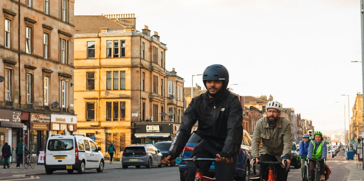 Group of people cycling through Glasgow