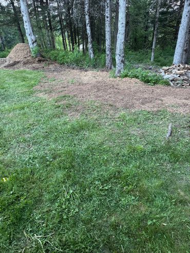 Large stump ground away and ground leveled out.
