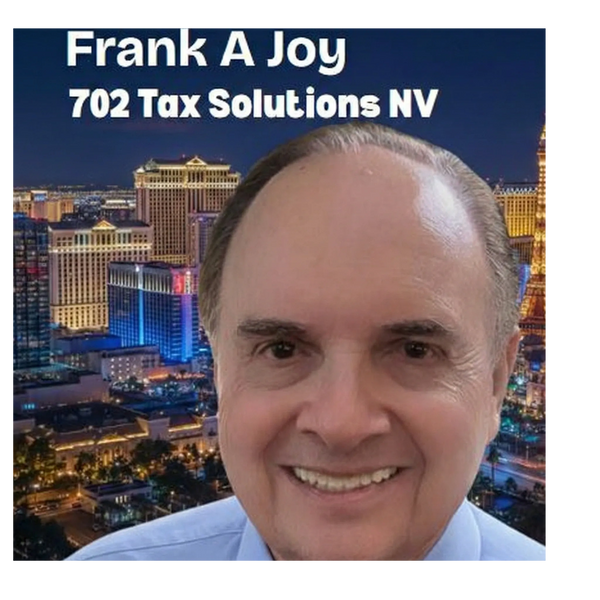 Smiling man promoting 702 Tax Solutions NV with Las Vegas skyline background.