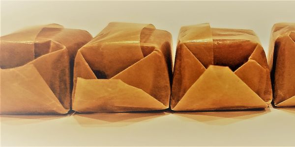 Hand wrapped caramels in soy based wax paper
