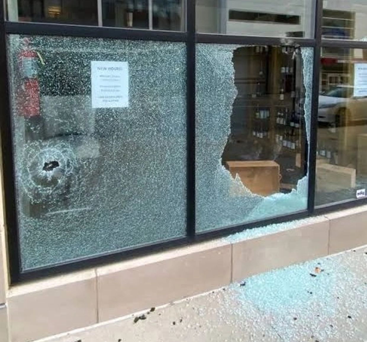 Broken commercial store window ready for board up