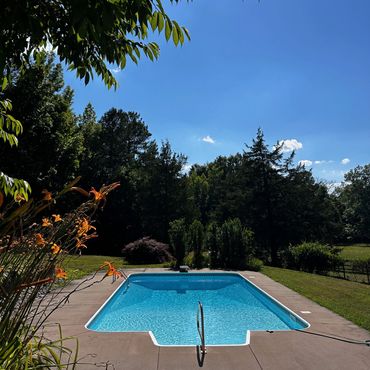 Swimming pool surrounded by horse pastures in Hillsborough, North Carolina