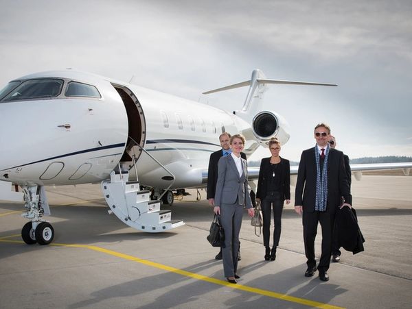 executive business team leaving corporate jet
