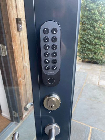 A smart lock fitted by A. B. Locksmith ltd to a door on a commercial visit in Godalming