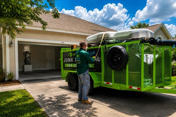 Junk Zilla and loaded trailer at a house cleanout in Palm Coast, FL