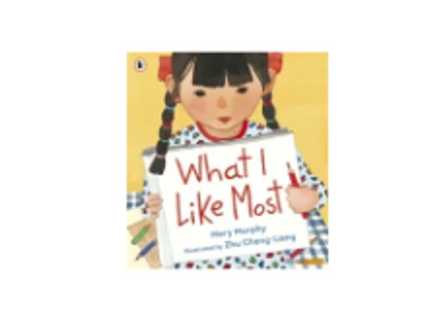 Illustrated book cover featuring a girl holding a sign that says 'What I Like Most'.