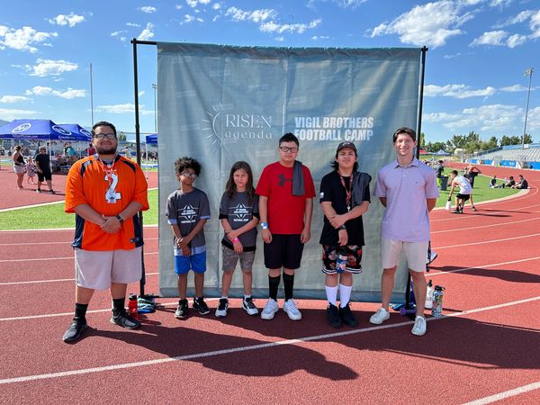 Group of six people at Vigil Brothers Football Camp.