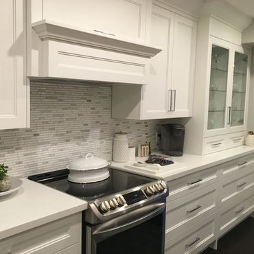Custom white kitchen remodel with center island – clean, modern design with built-in storage