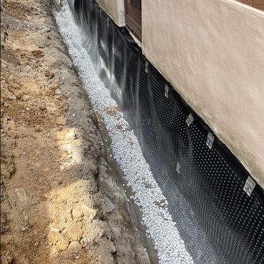 Preventing water intrusion with high-performance foundation wrap in GTA residence.