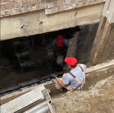 Basement waterproofing system with advanced moisture barrier installation.