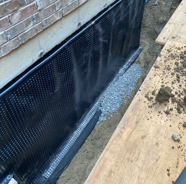 Exterior foundation waterproofing in Toronto home to prevent basement flooding.