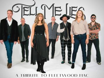 Seven musicians posing for 'Tell Me Lies: A Tribute to Fleetwood Mac'.