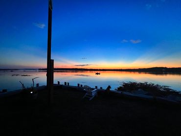 Western sunsets from the Boat House looking at Castine, Islesboro and the Camden Hills, Maine