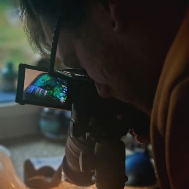 Man photographing jewellery