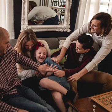 Lifestyle family photoshoot with tickling and laughing inside their home. Phoenix, AZ