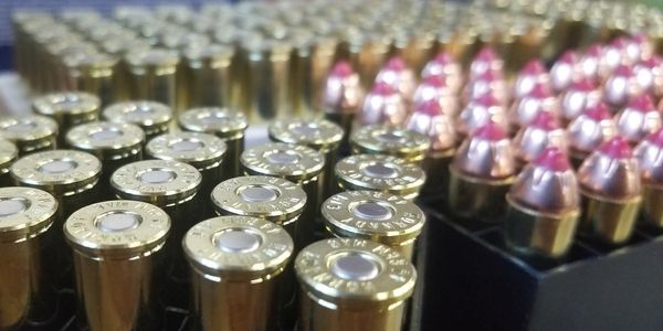 Rows of brass ammunition rounds.
