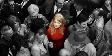Woman wearing red looking lost in crowd