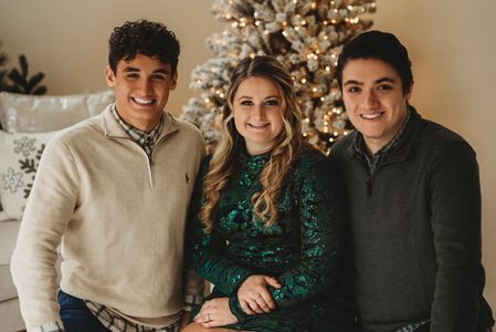 Two boys and a girl posing