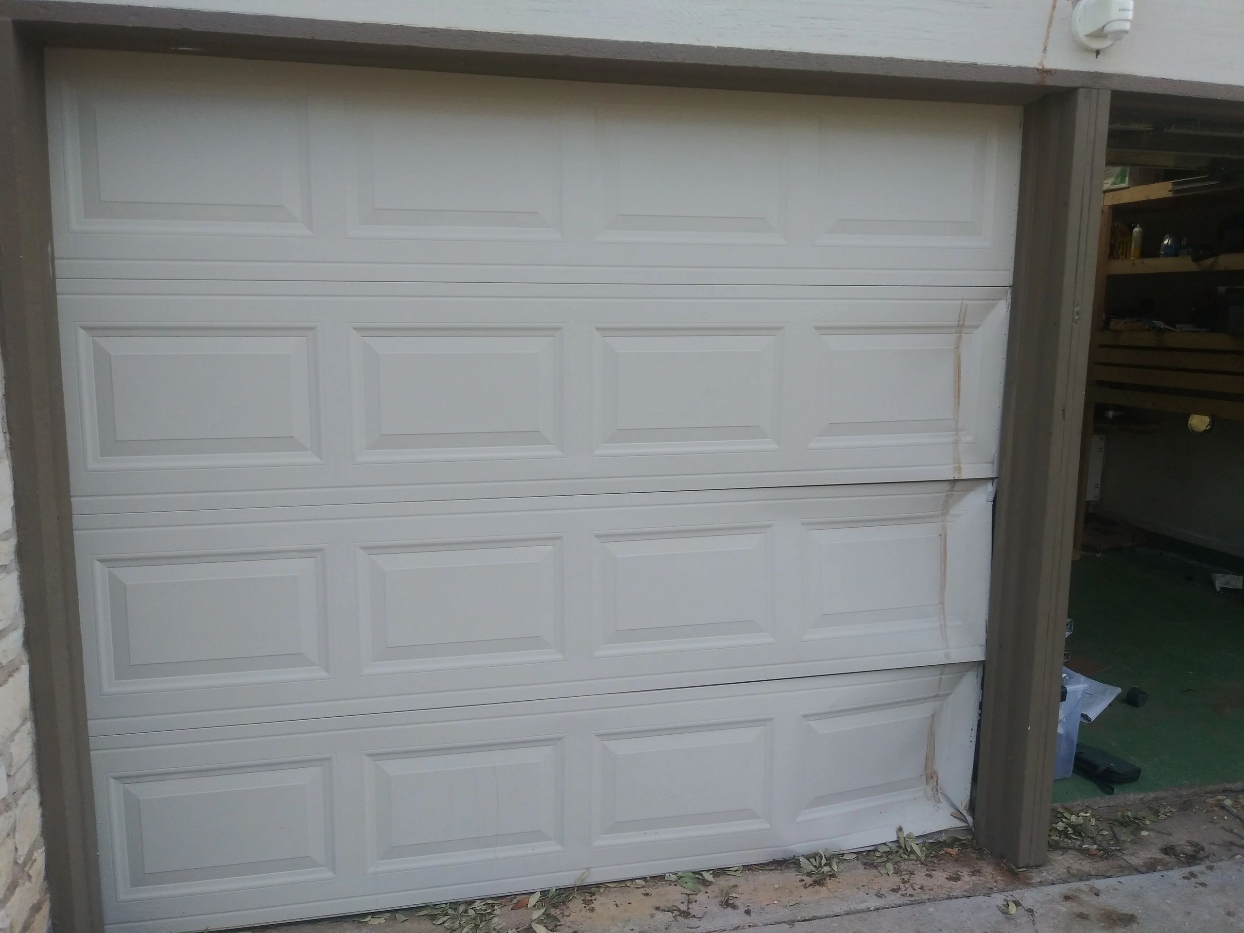 Replacement of garage door panels/garage door repair in Austin