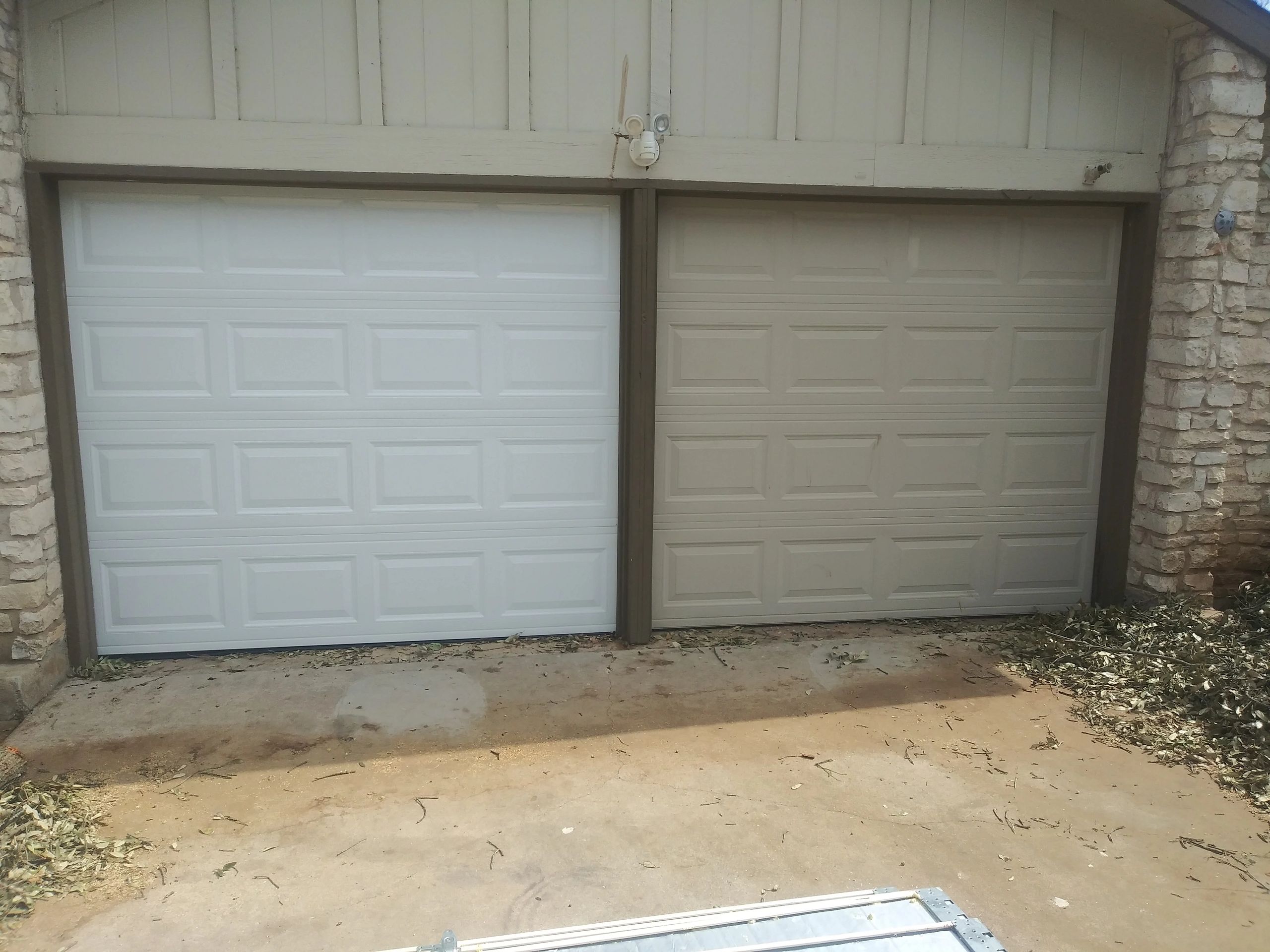Replacement of garage door panels in south austin.