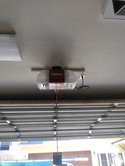 New motor was requested sameday. We installed a new 8587 garage door opener on wood door.
