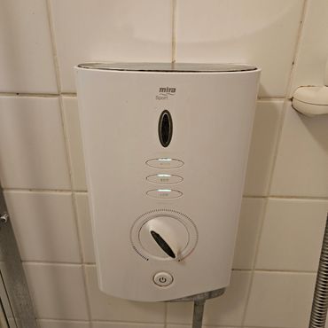 A new electric shower image fitted in a bathroom