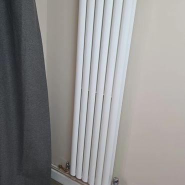 A white tall radiator
