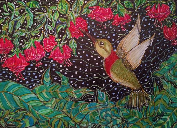 Hummingbird feeding on flowers