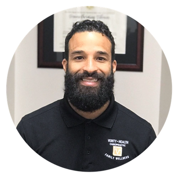 A picture of a Isaac Montilla, owner of Verity Health with a beard, smiling.