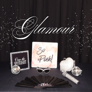 Glamour-themed decorative setup with sparkling accessories and signs.