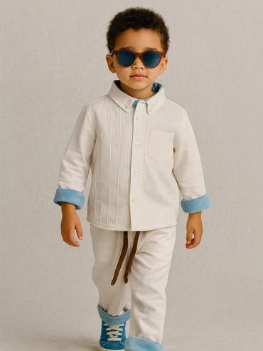 Stylish toddler wearing Kasmai cream outfit with blue accents and pinstripe pintuck shirt, affordable designer boysβ wear