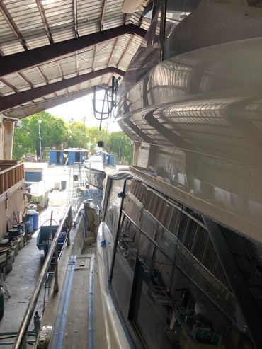50' Azmut motor yacht. Vessel is getting wet sanded, compounded, polished, and a coat of underdog