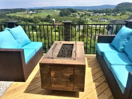 Handmade custom cement concrete portable fire table made to look like real wood rustic feel heavy grain by Rustic Elegance on leveling feet propane or natural gas high heat warm for warmth 65,000 BTUs to 125,000 BTU output Capital City Public Market Boise Idaho ID and Patio Life Eagle Idaho ID brown