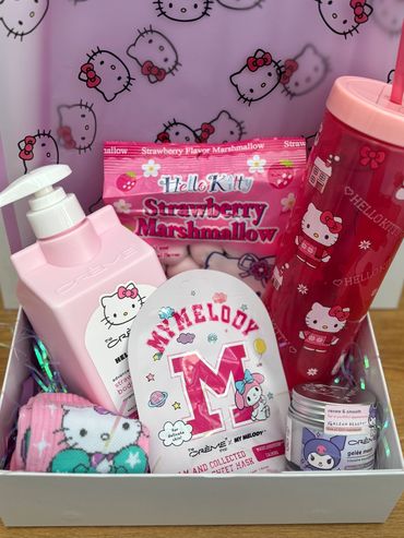 Hello Kitty-themed gift box with skincare, snacks, and accessories in pink.