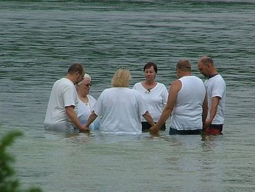 Praying in lake before batisms & re-dedications