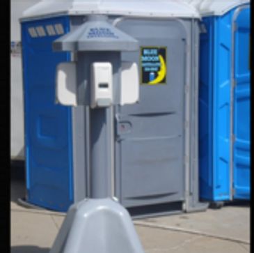 Free standing hand sanitizer stand with four dispensers.