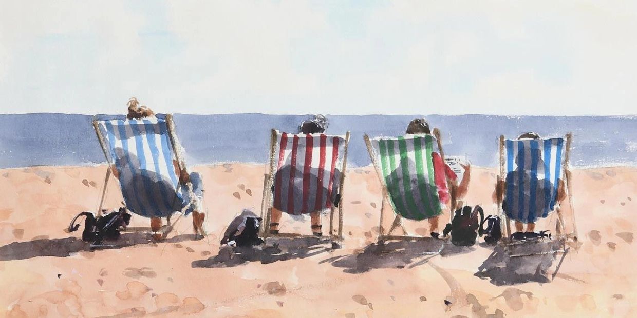 Four people sitting in striped deck chairs at the beach.